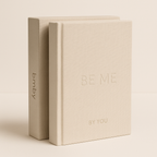 Two beige books with 'BE ME BY YOU' text on a light beige background