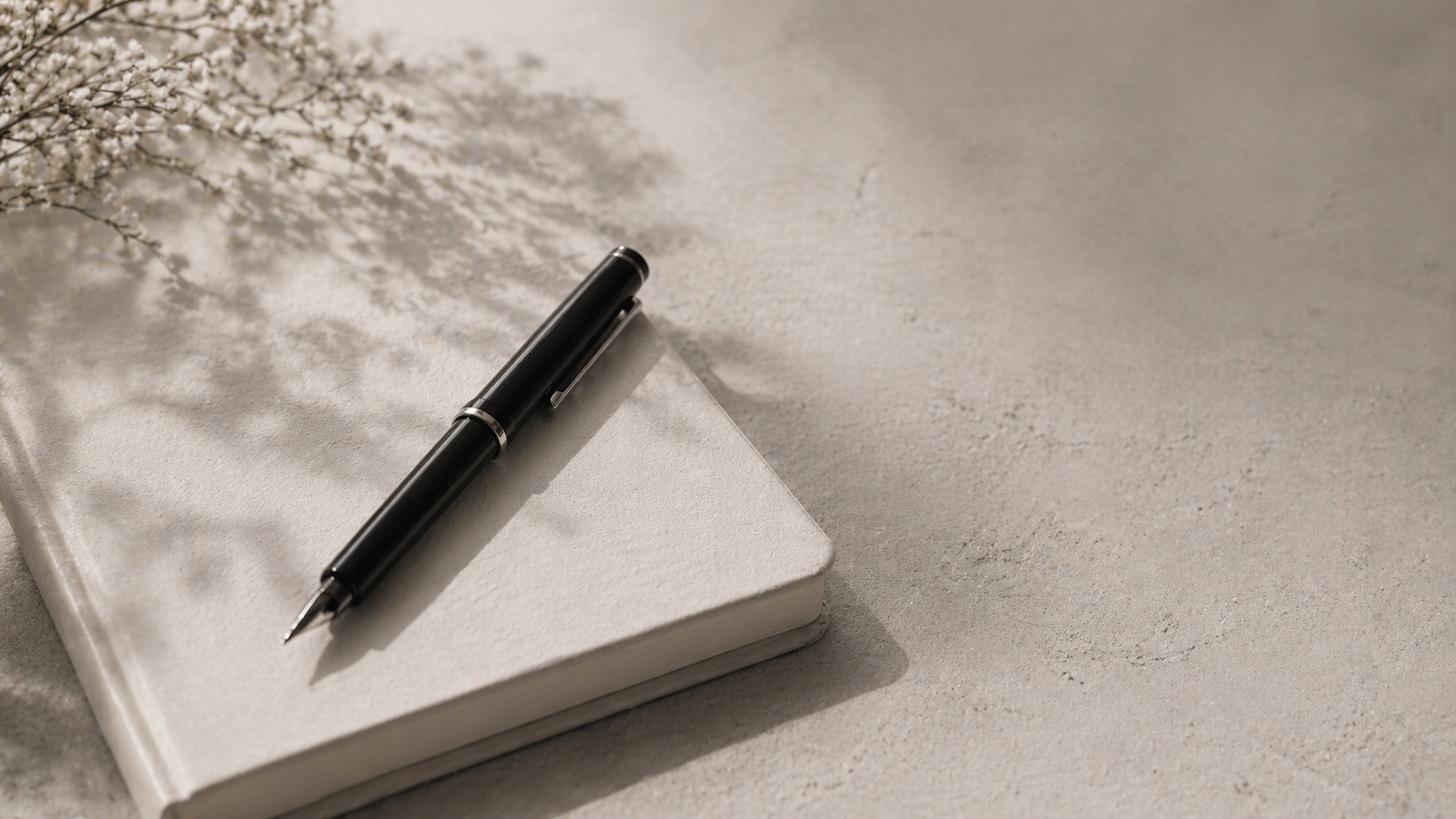 Contact page journal and pen lifestyle image